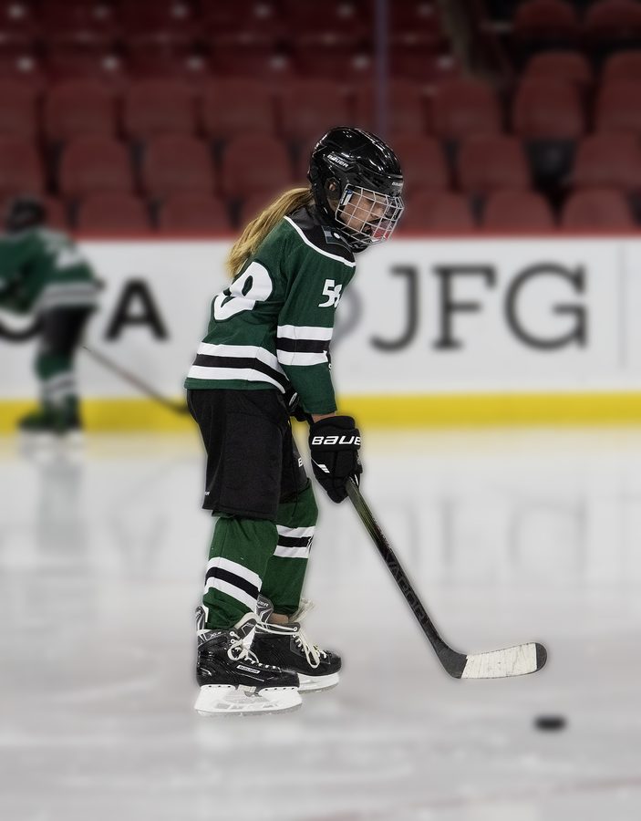 Lezja, number 58, with the puck
